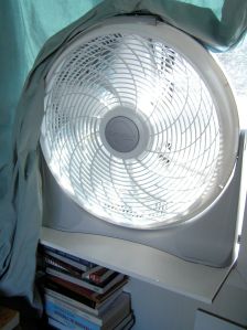 Fan on makeshift shelf